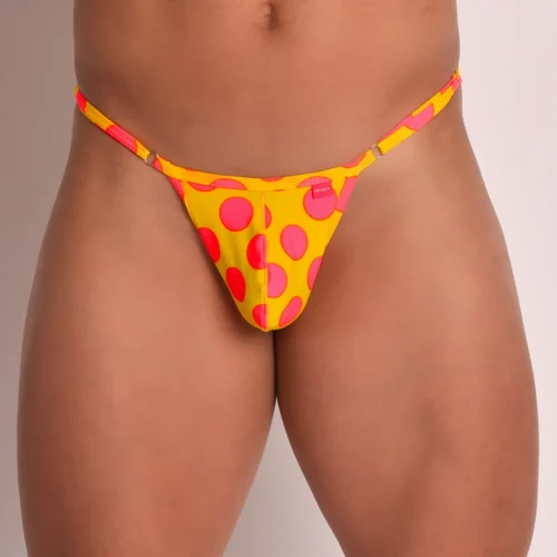 Frontal view of a Yellow men’s swim thong with pink dot print and adjustable side straps
