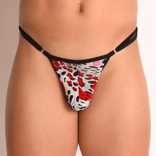 Close-up of the Marcella printed mesh pouch — red, black, and white psychedelic print, black bind, and pink Oh Lola tag.